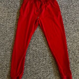 ZYIA Vibrant Red Joggers with Gold Zipper Accents